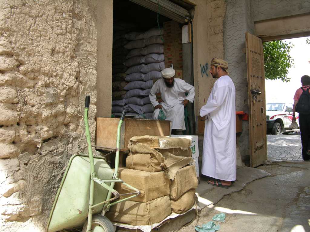 Muscat 06 Nizwa 03 Old Market Typical Stall We walked through the old Nizwa souq, glancing at the old men displaying their wares.